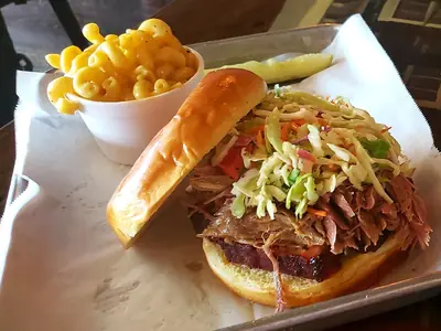 The Smokehouse Big Hog: pork belly, pulled pork and coleslaw on a toasted bun with mac and cheese