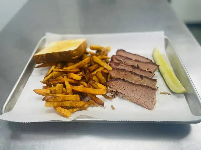 Sliced smoked brisket showing a smoke ring