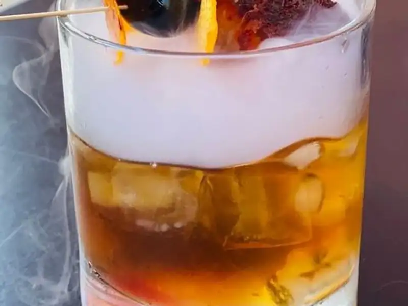 A smoked Old Fashion cocktail at the Old Town Smokehouse bar